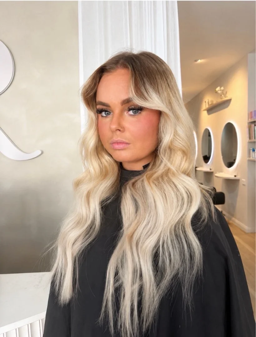 Long, lived-in blonde waves styled by a blonde specialist at Runway Tamworth