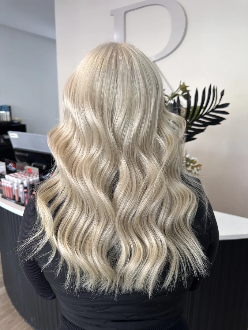 Long, bright blonde colour with soft waves at Runway hair colouring in Tamworth