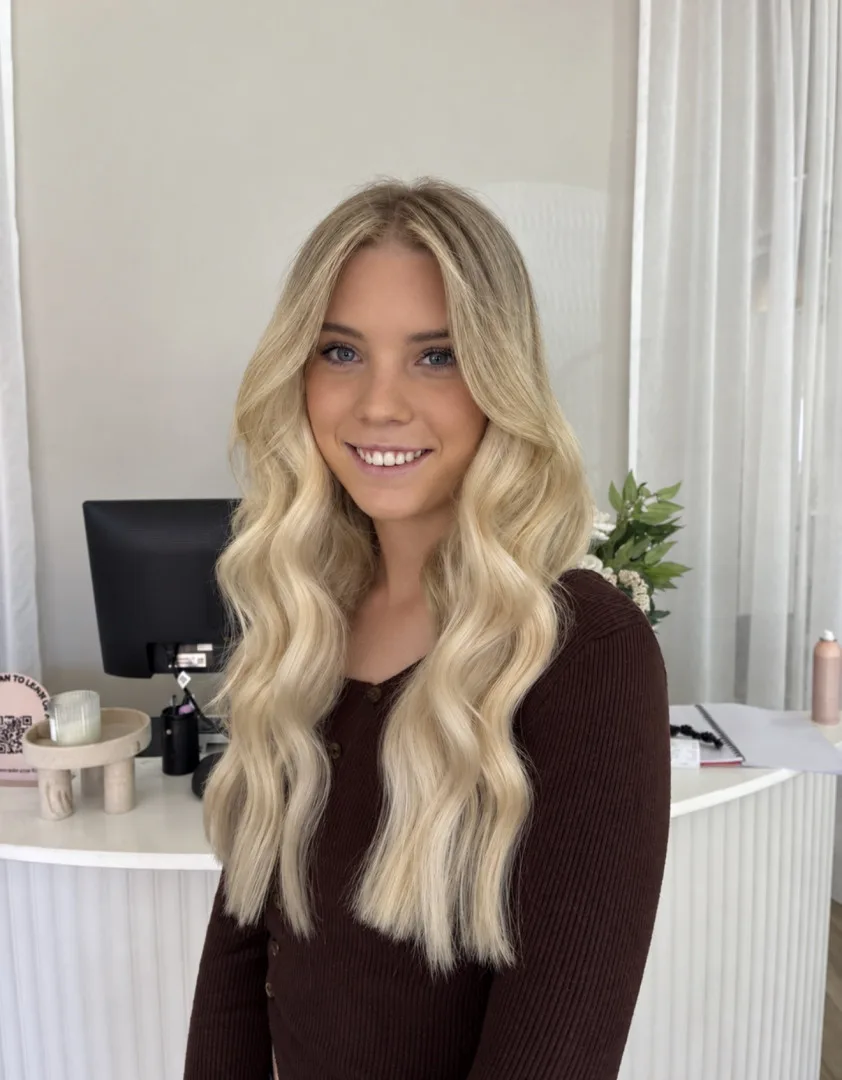 Soft blonde colour with long waves finished at Runway Tamworth