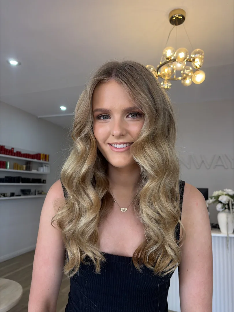 Soft honey blonde colour with loose waves finished at Runway Tamworth